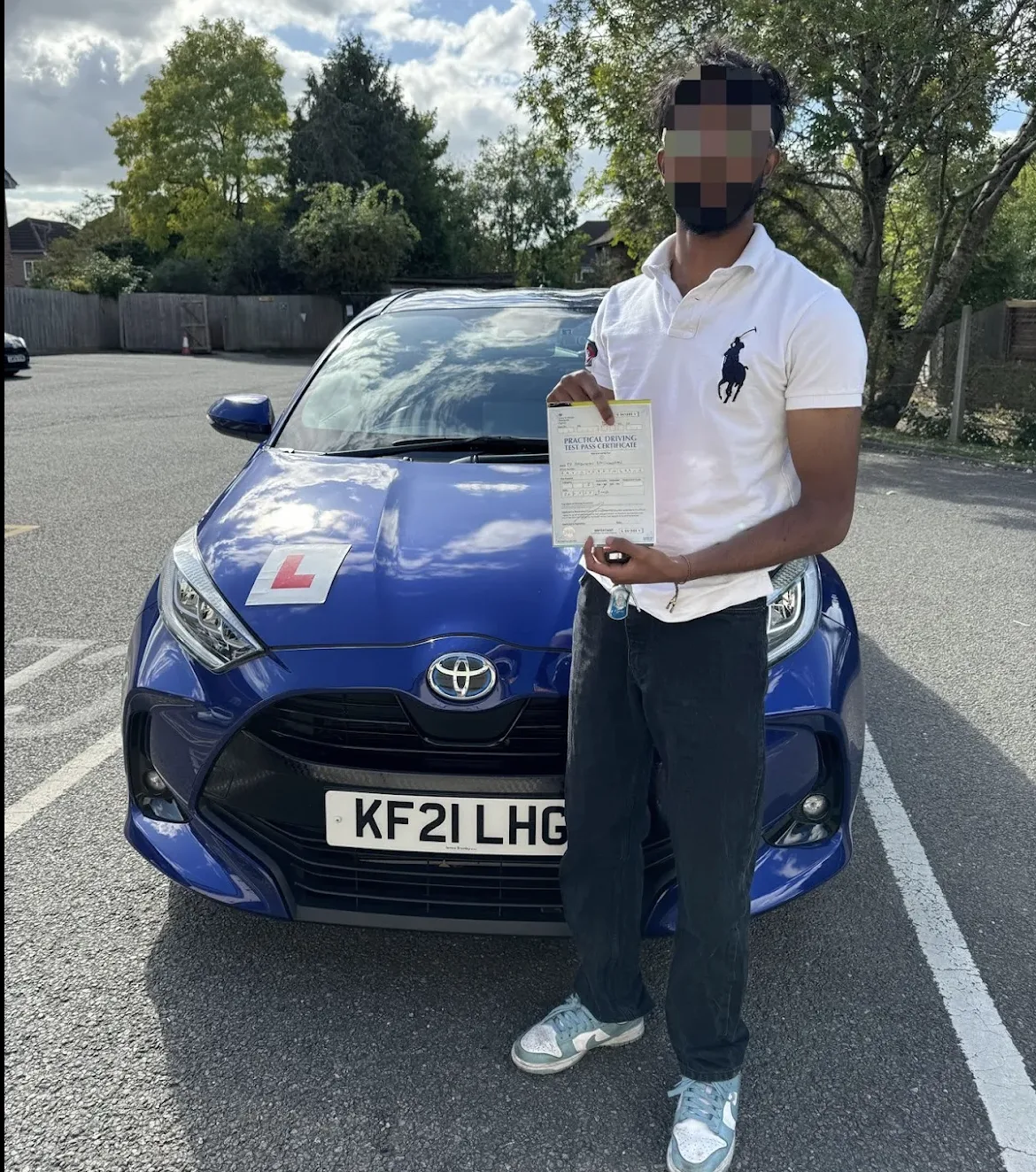 Saisharan Ravi holding driving test pass certificate outside DVSA test centre in North London